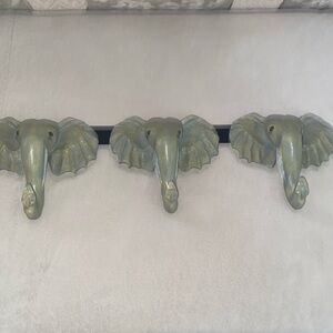 Elephant hooks. Large elephant head hooks, in as new condition.